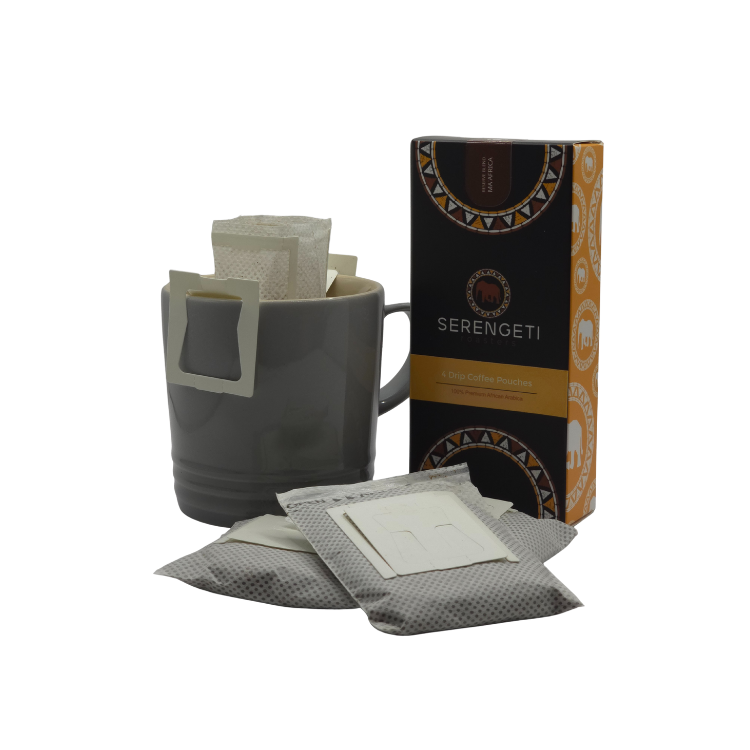 Ma’Africa Reserve Blend Pour-Over Coffee pouch and four-pack presentation. Includes pouch in mug illustration and two loose pouches, highlighting premium African Arabica blend with milk chocolate, caramel, and gentle fruit notes. Filter coffee packed fresh for pour-over brewing.